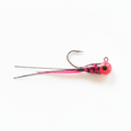 Pink jig with pink tail and two black string tails